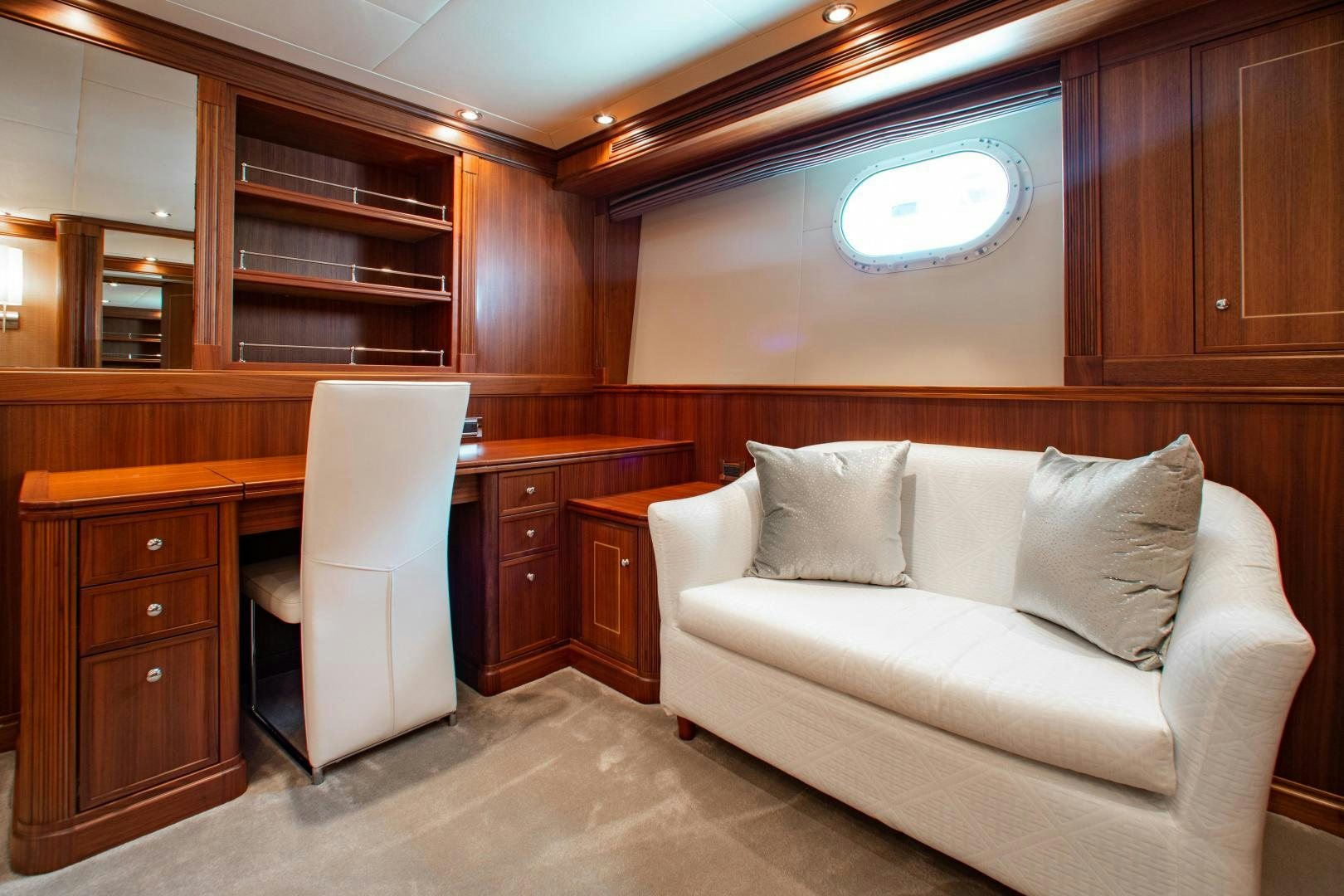 a room with a couch and a chair aboard BLACKSHEEP Yacht for Sale