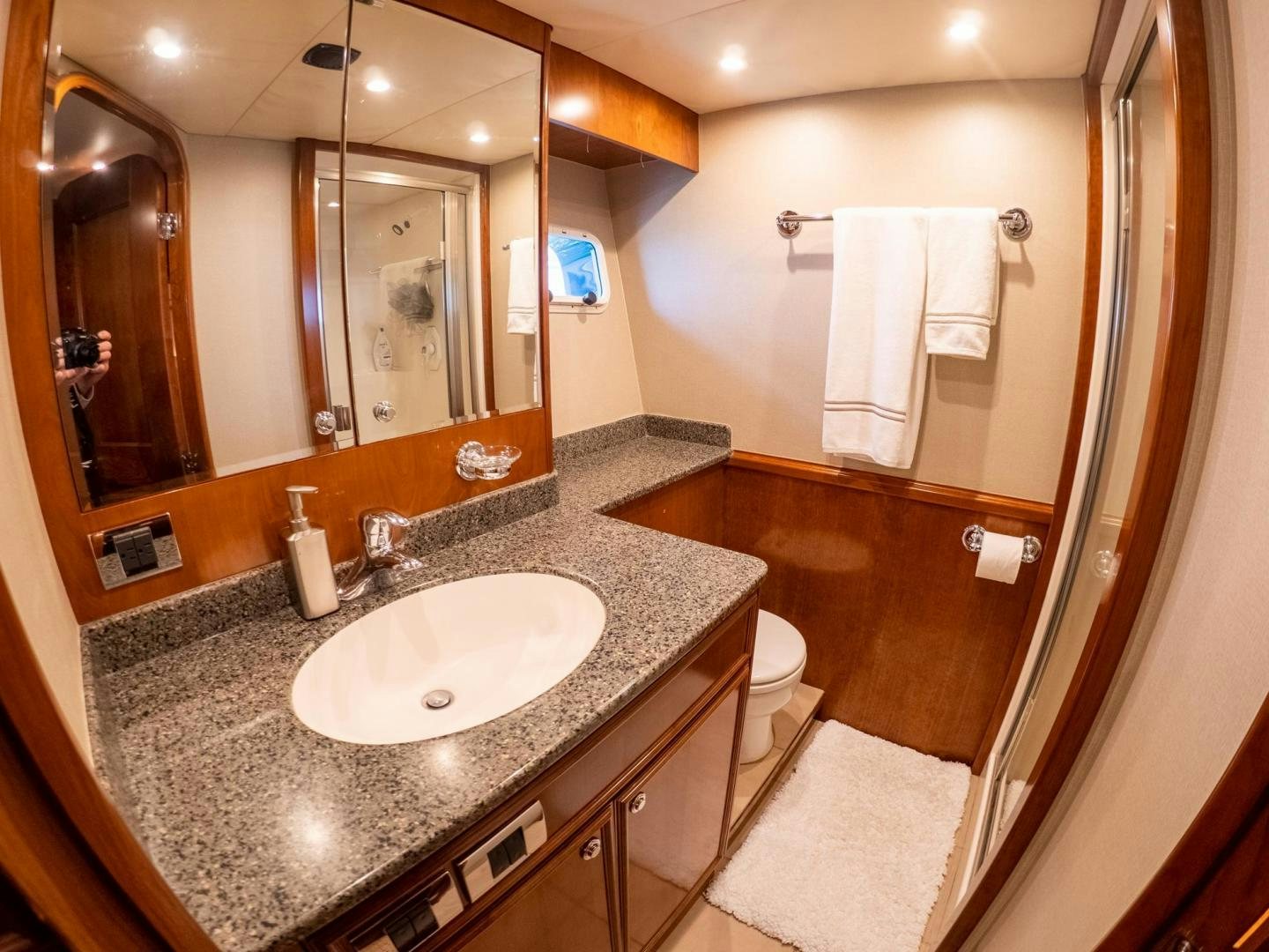 a bathroom with a large mirror aboard LONE WOLF Yacht for Sale