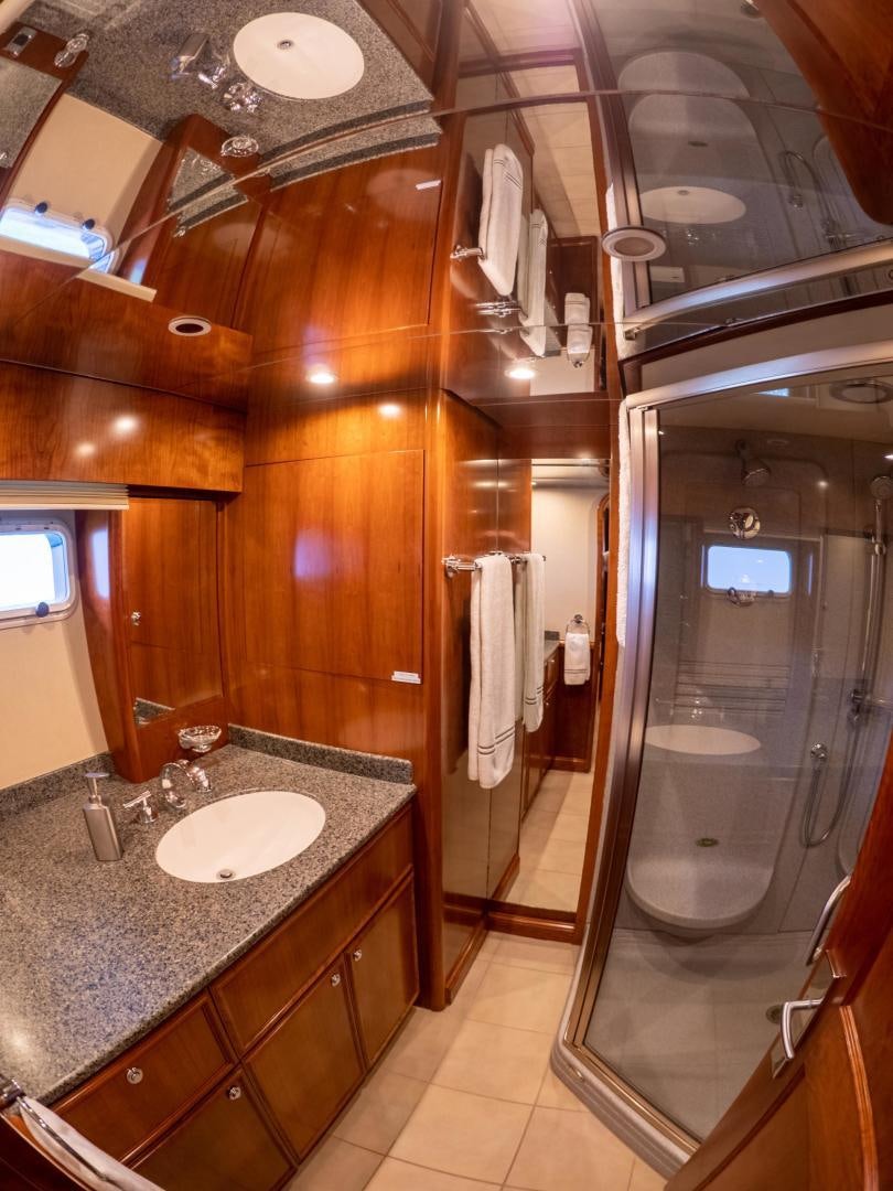 a bathroom with a sink and a shower aboard LONE WOLF Yacht for Sale
