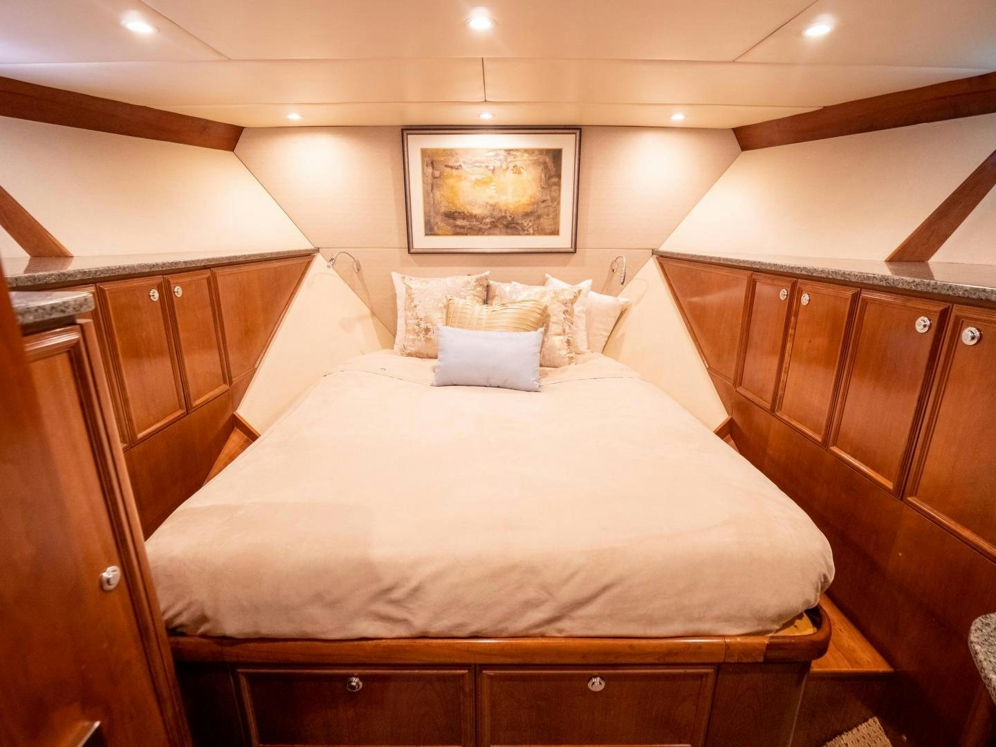 a bed with white sheets aboard LONE WOLF Yacht for Sale