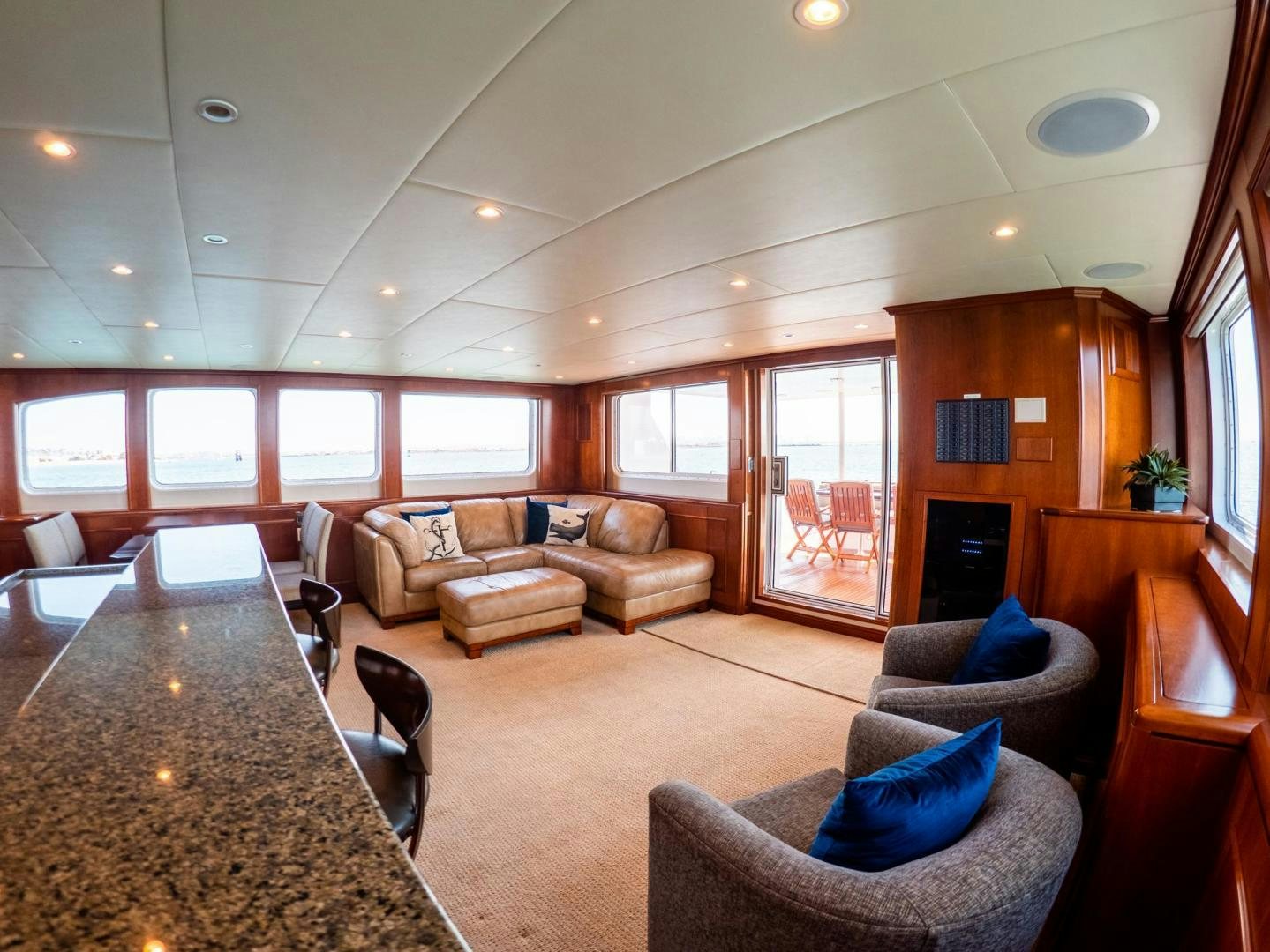 a living room with a large window aboard LONE WOLF Yacht for Sale