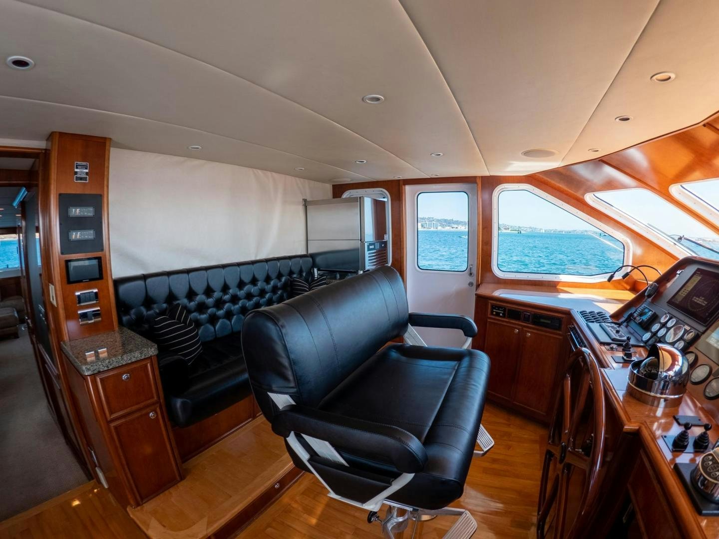 a room with a desk and chairs aboard LONE WOLF Yacht for Sale