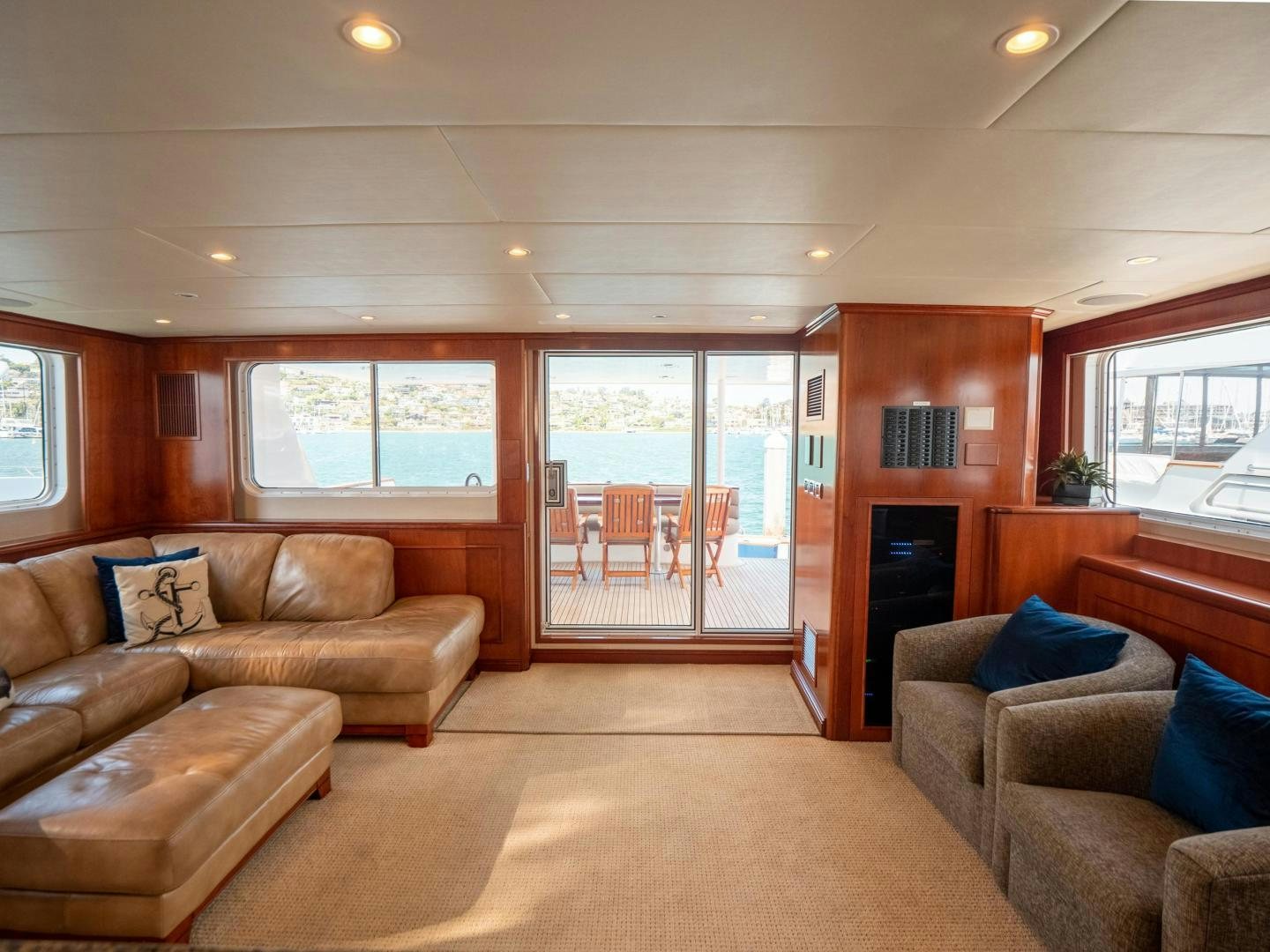 a living room with a couch and a fireplace aboard LONE WOLF Yacht for Sale