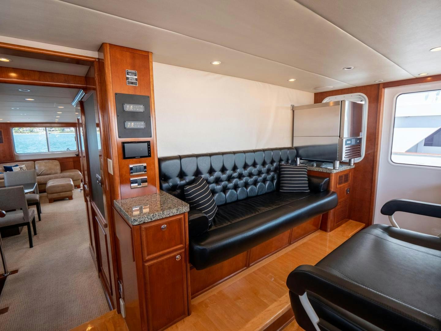a room with a couch and a table aboard LONE WOLF Yacht for Sale
