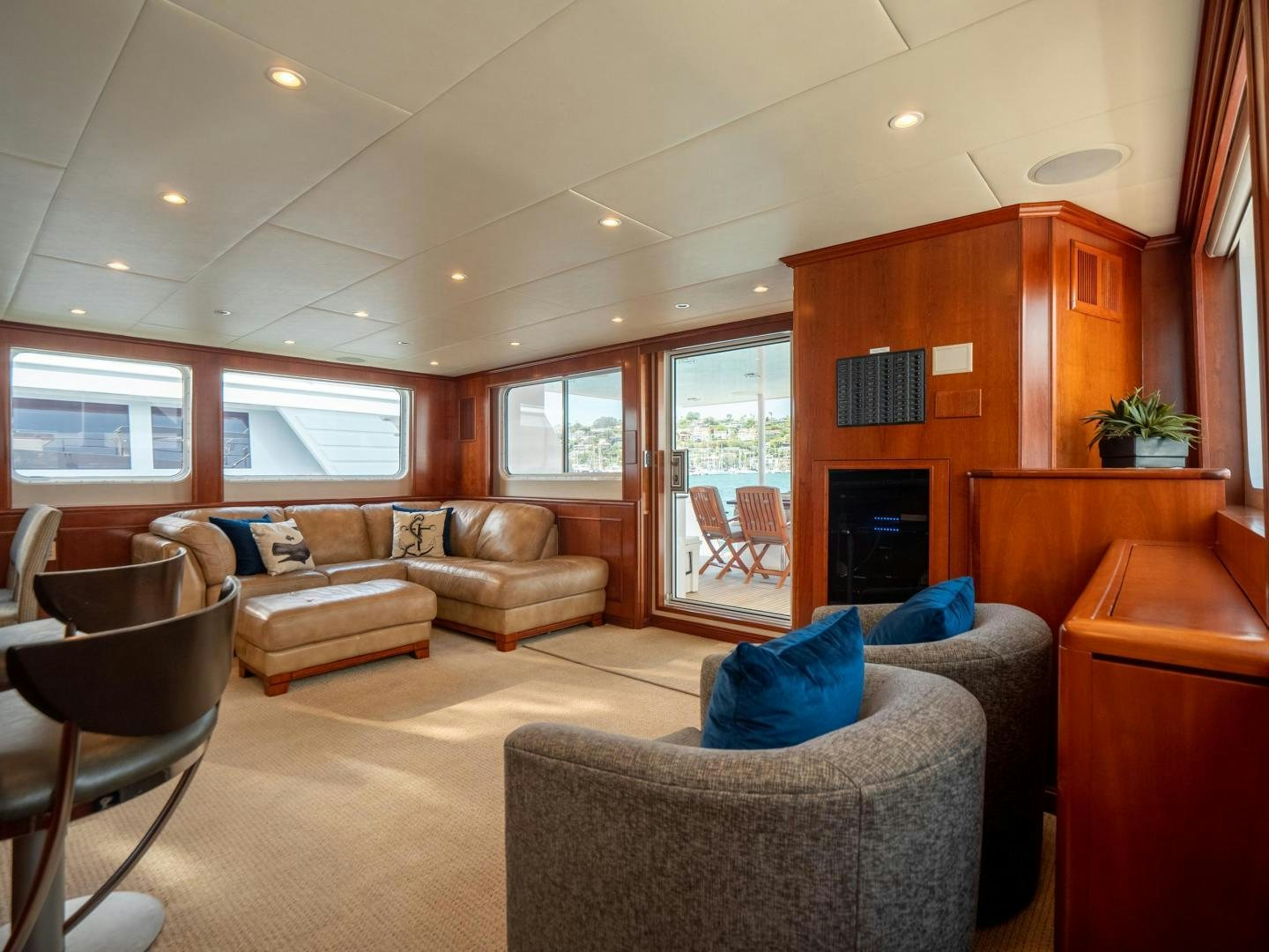 a living room with a couch and a fireplace aboard LONE WOLF Yacht for Sale