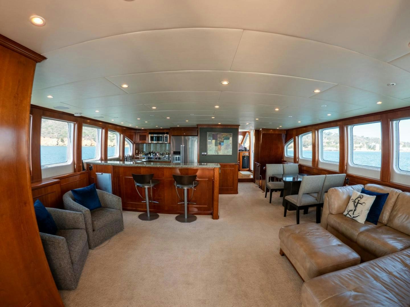 a living room with a large window aboard LONE WOLF Yacht for Sale