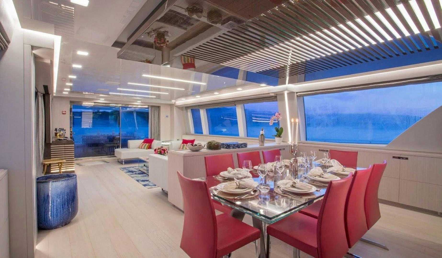 a dining room with a table and chairs aboard ALANDREA Yacht for Sale