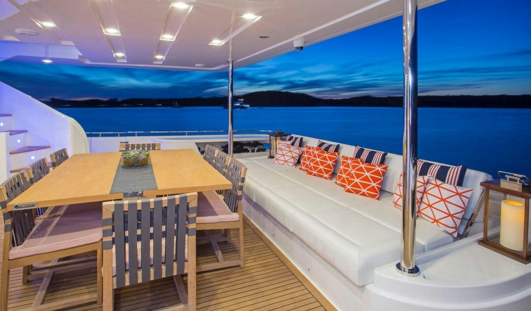 a room with tables and chairs aboard ALANDREA Yacht for Sale