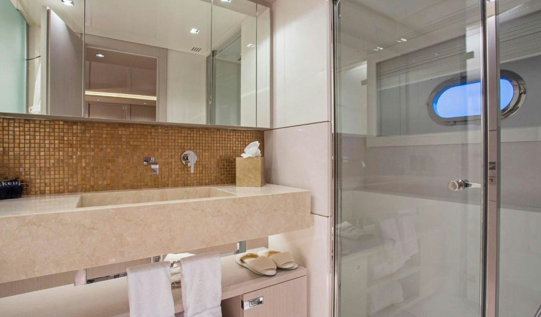a bathroom with a large mirror aboard ALANDREA Yacht for Sale