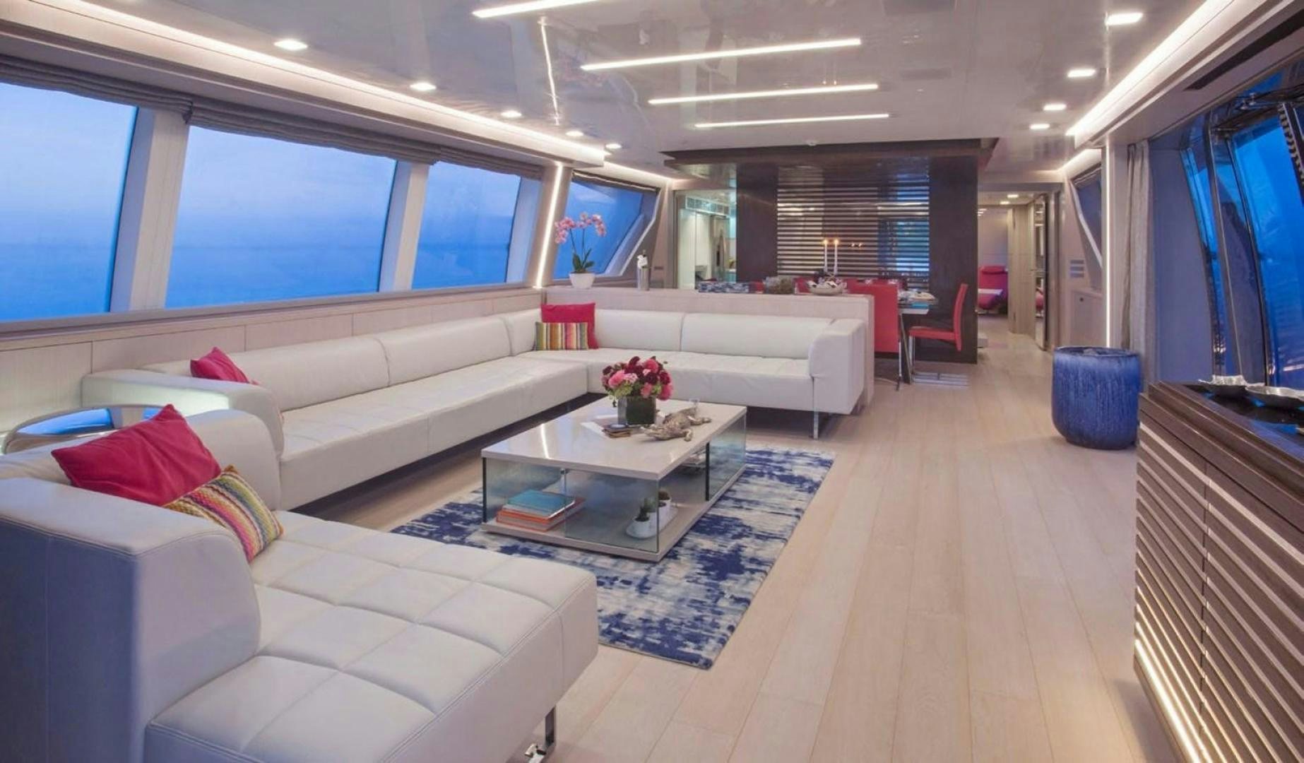a room with a couch and a coffee table aboard ALANDREA Yacht for Sale