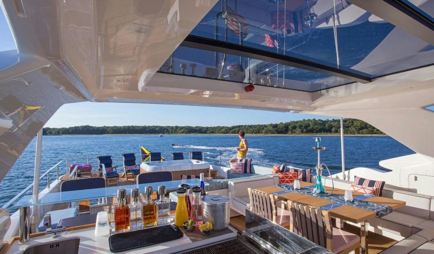 a person standing on a deck of a boat aboard ALANDREA Yacht for Sale
