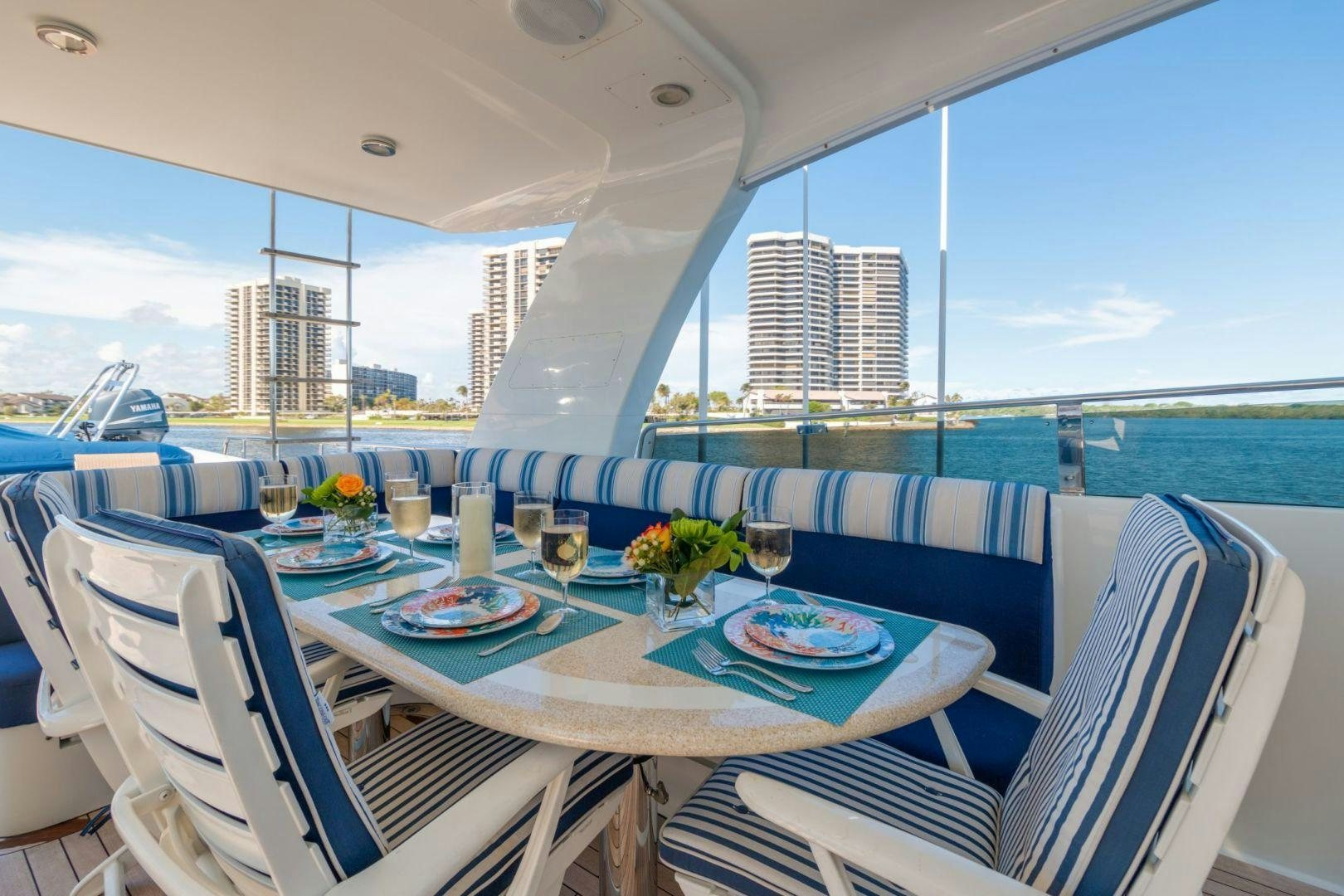 a table with plates and glasses on it aboard WINDWARD Yacht for Sale