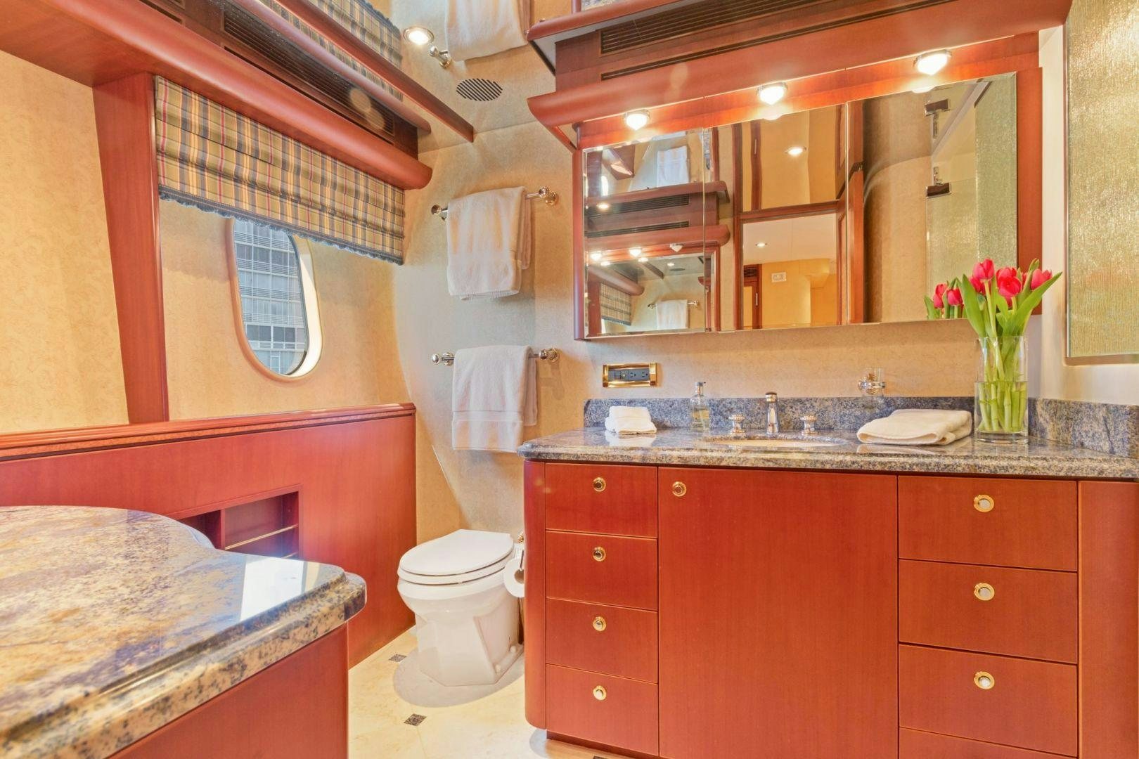 a bathroom with a large mirror aboard WINDWARD Yacht for Sale