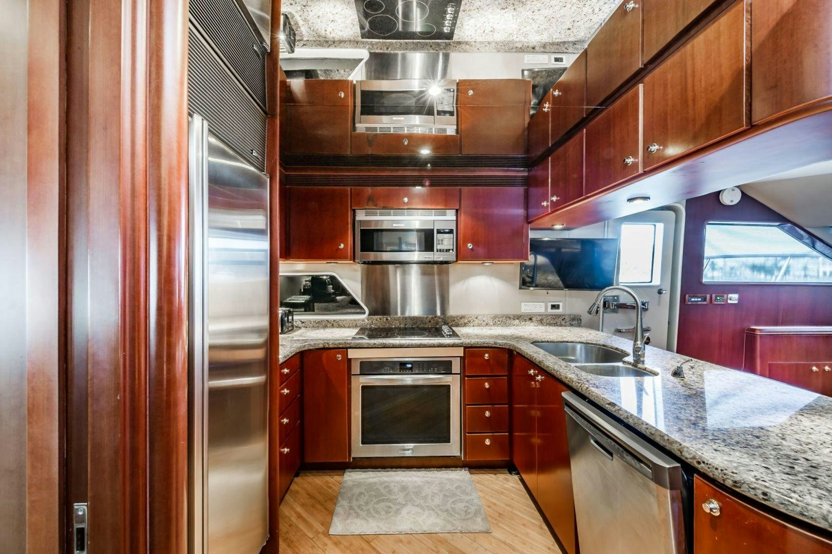 a kitchen with a stove and oven aboard WINDWARD Yacht for Sale