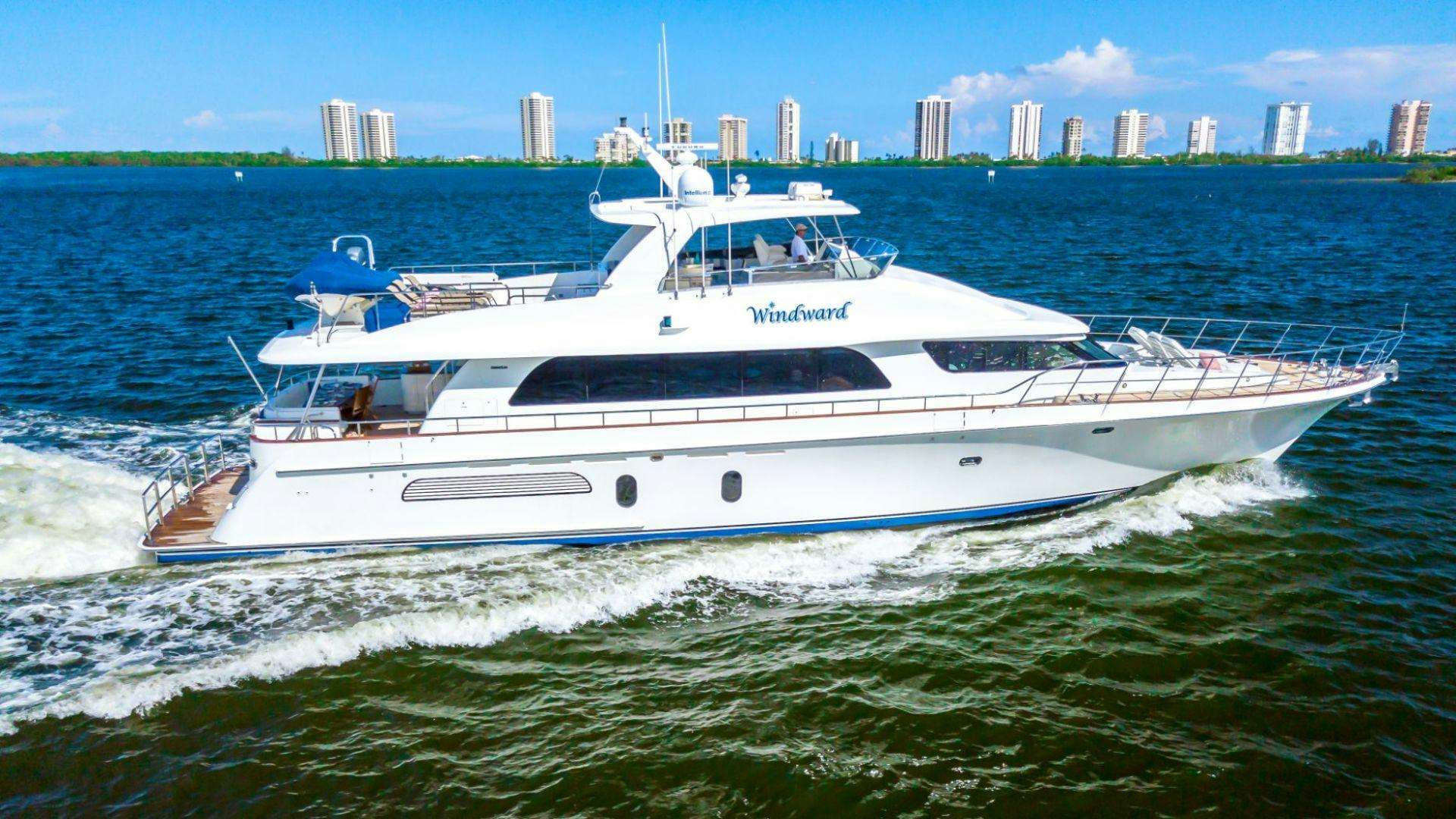 a white yacht on the water aboard WINDWARD Yacht for Sale