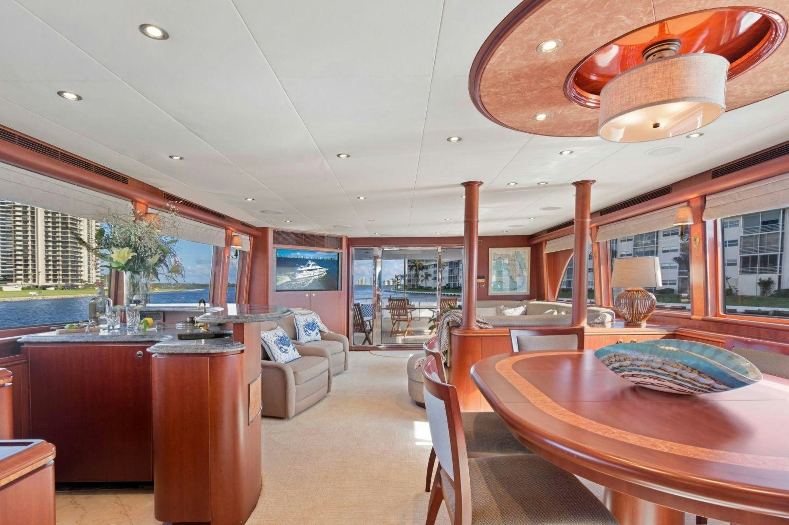 a room with a table and chairs aboard WINDWARD Yacht for Sale