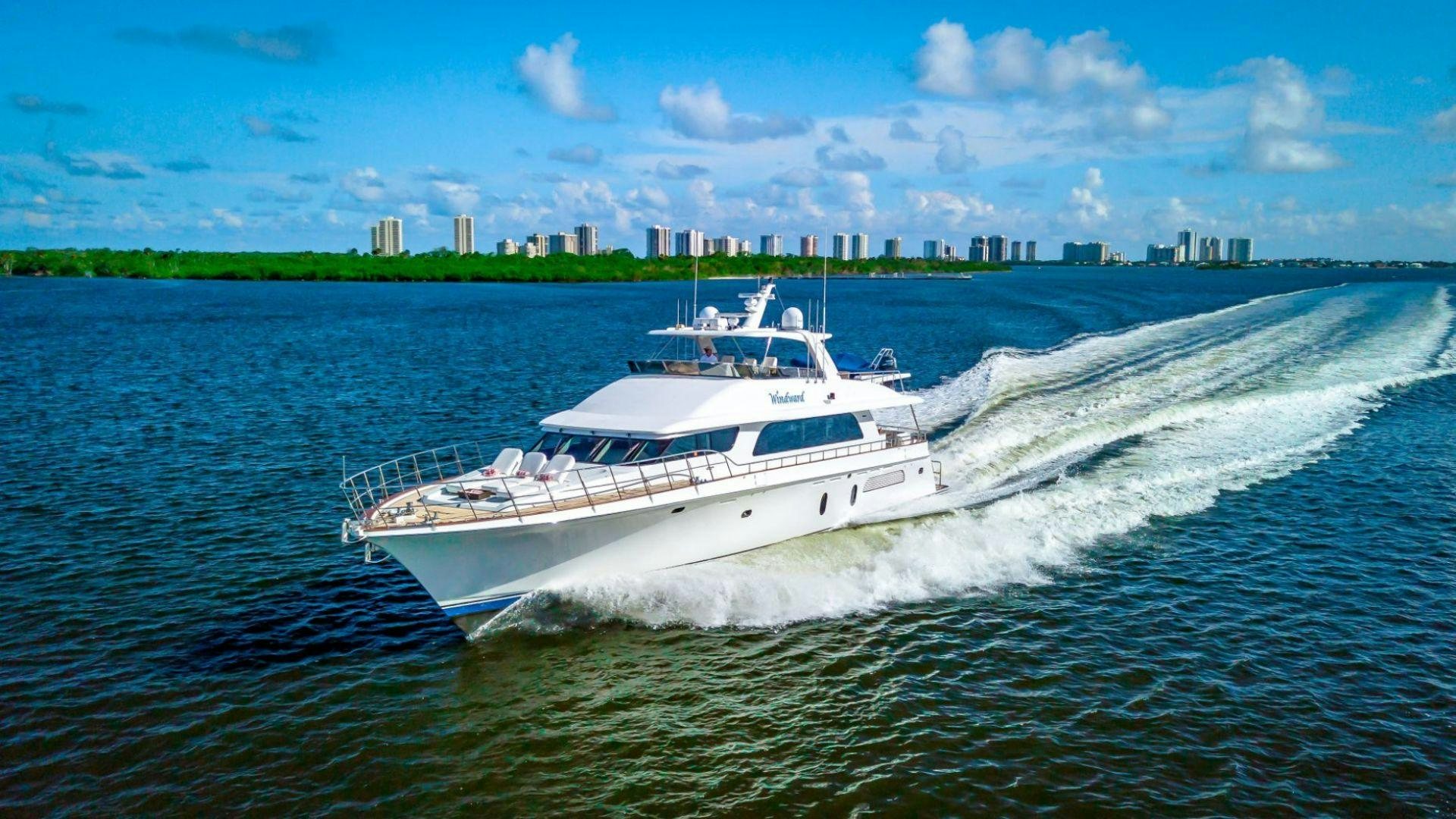 a white boat on water aboard WINDWARD Yacht for Sale