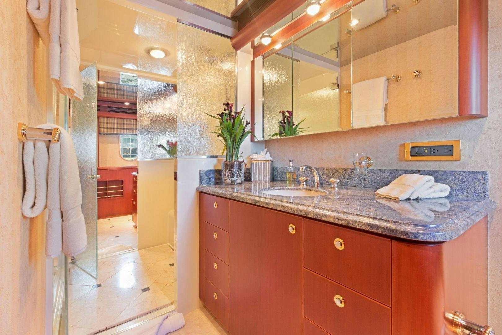 a bathroom with a sink and cabinets aboard WINDWARD Yacht for Sale