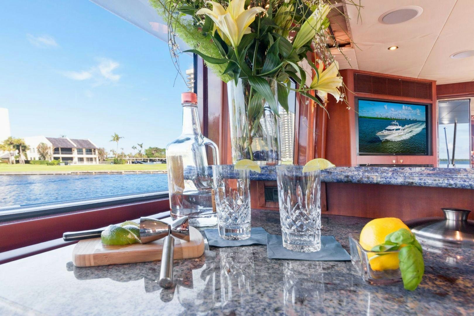 a table with glasses and food aboard WINDWARD Yacht for Sale