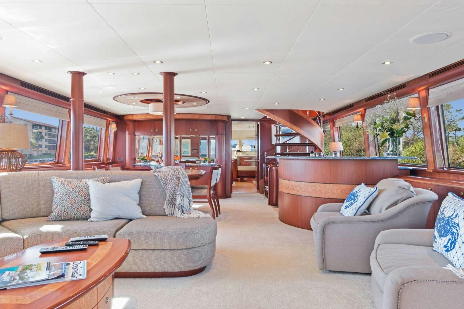 a living room with a couch and a table aboard WINDWARD Yacht for Sale
