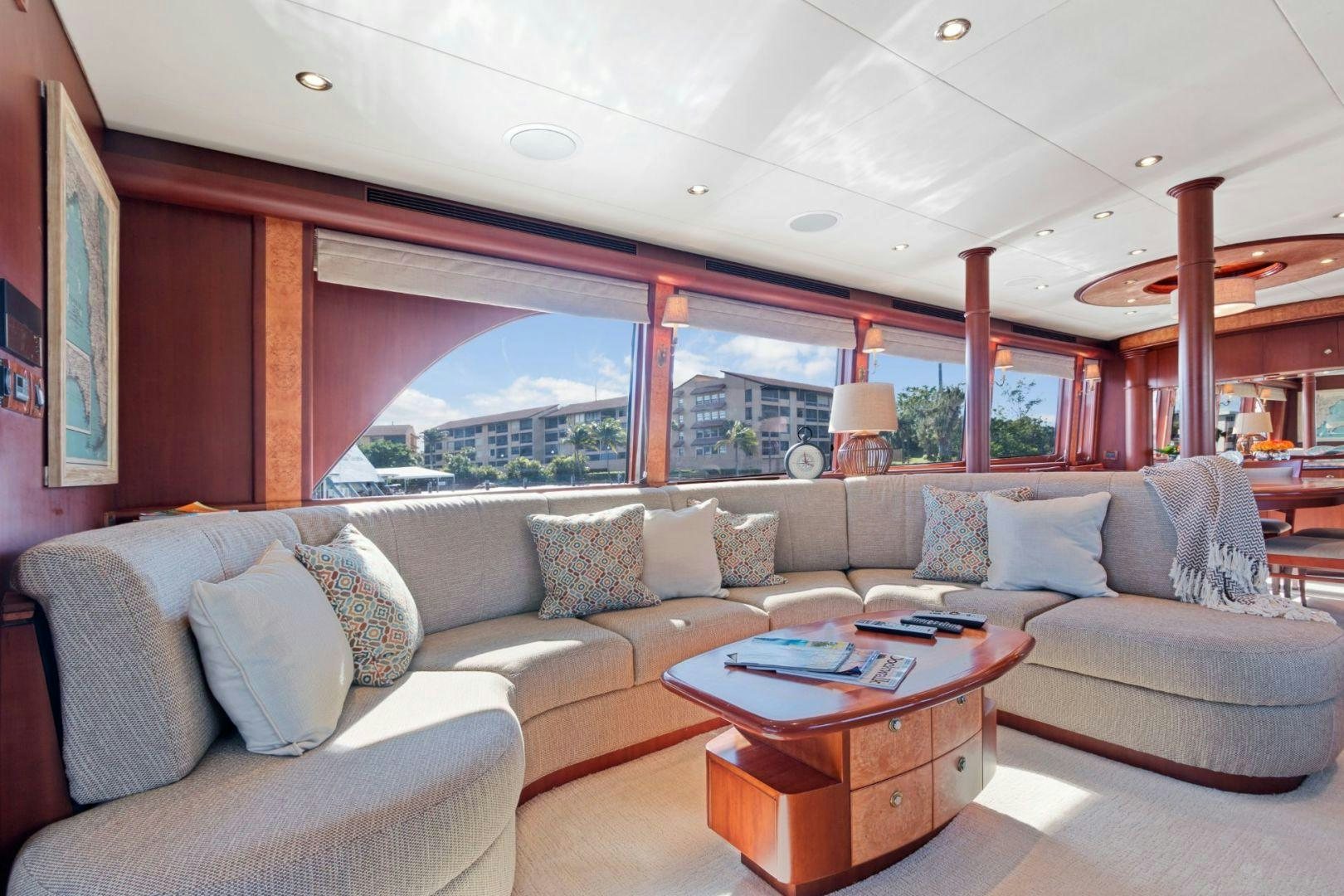 a living room with a couch and a table aboard WINDWARD Yacht for Sale
