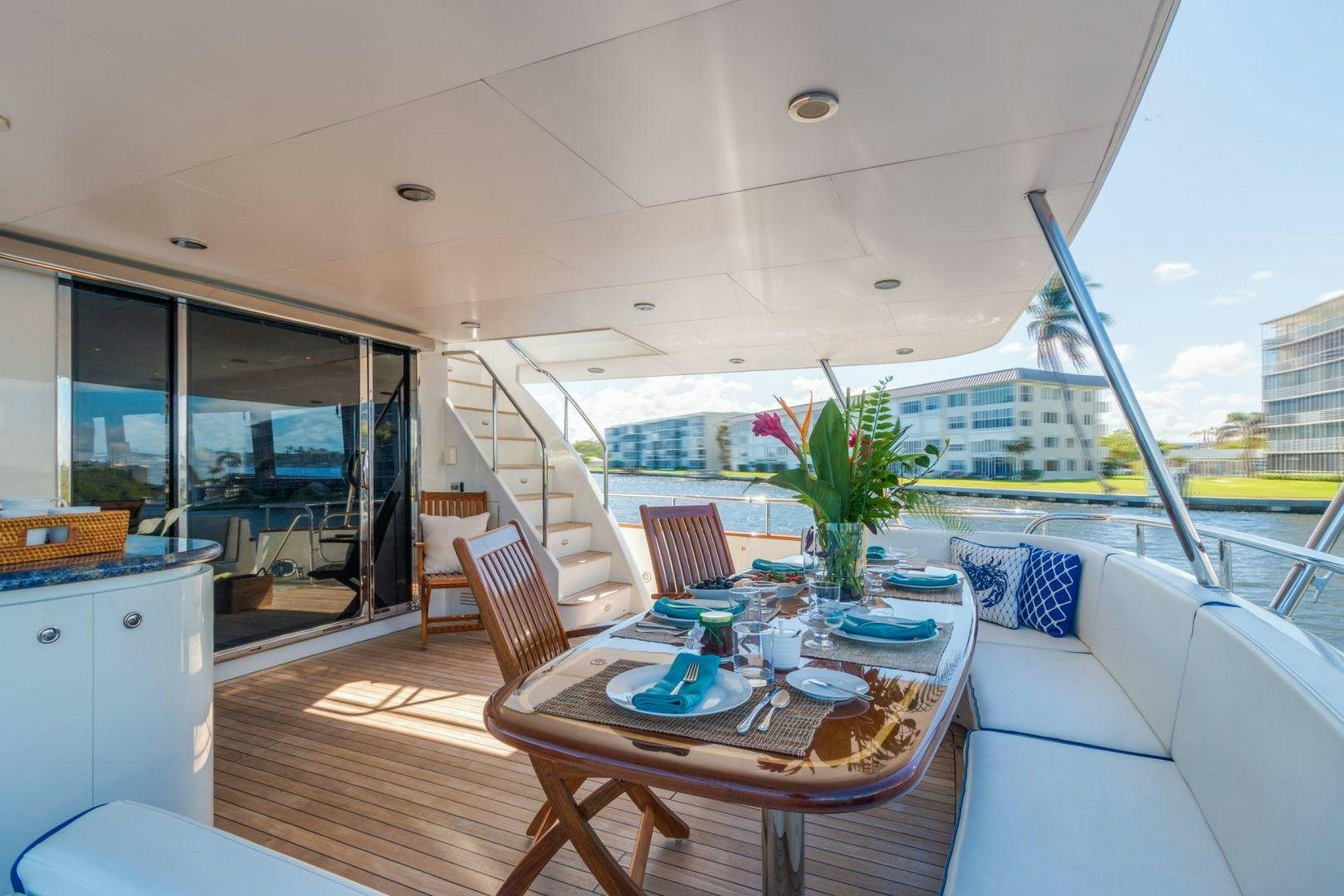 a table and chairs on a deck aboard WINDWARD Yacht for Sale