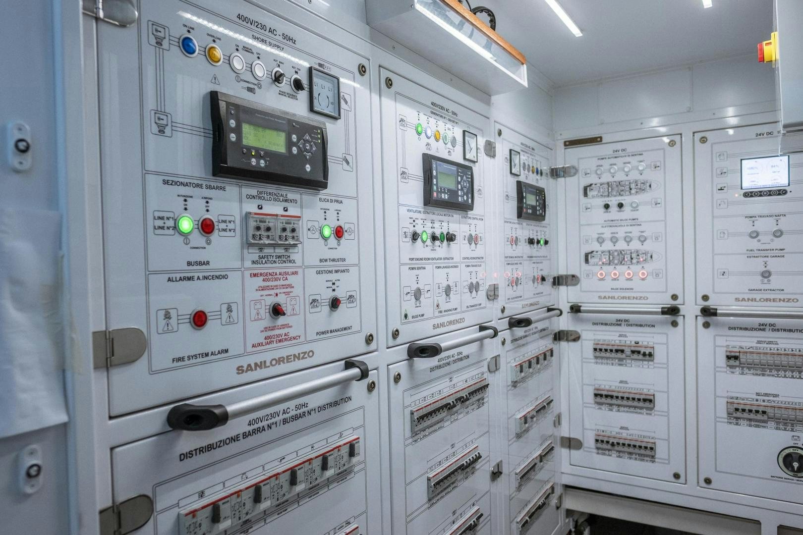 a room with several computer screens aboard AKAR XIII Yacht for Sale