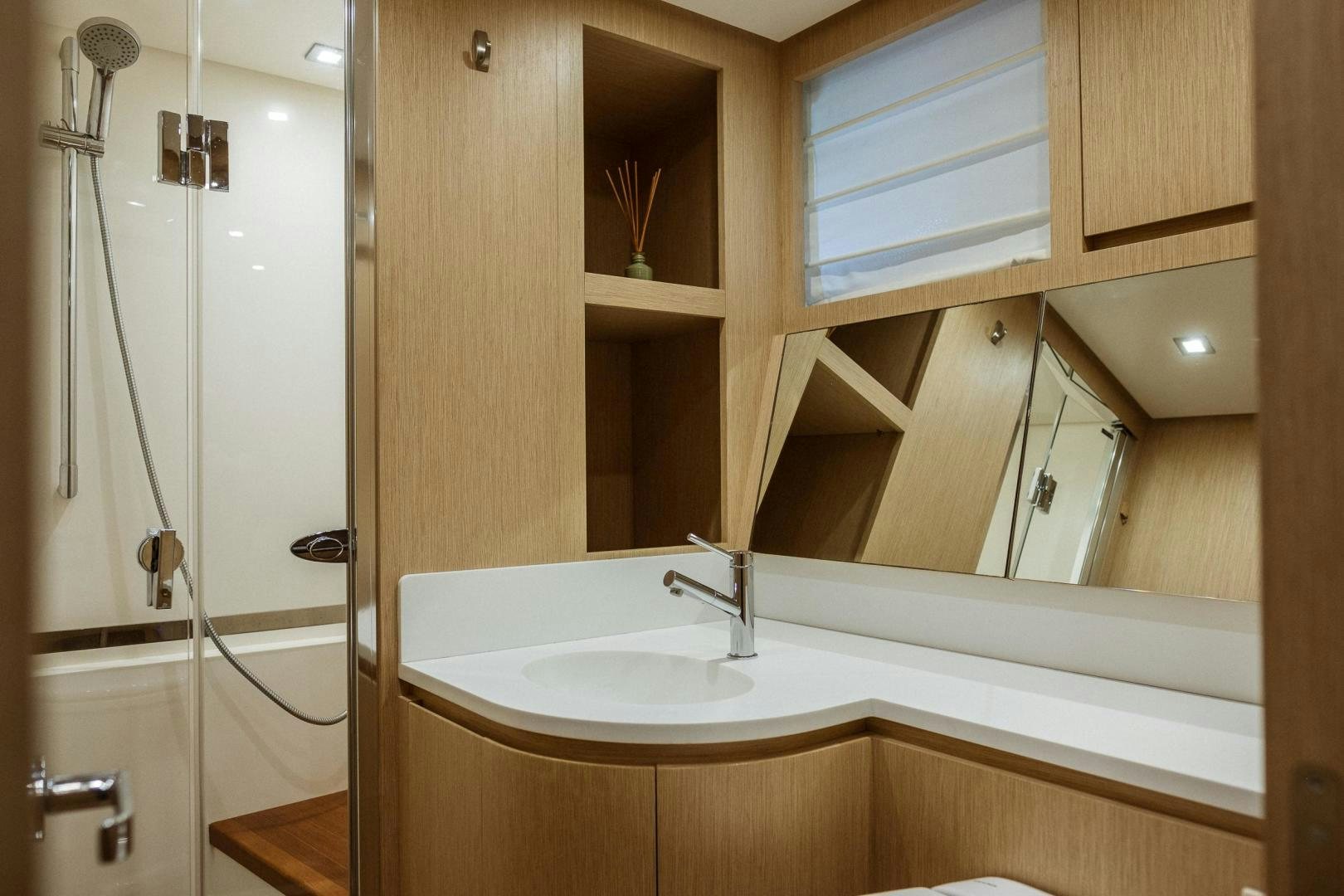 a bathroom with a sink and a shower aboard AKAR XIII Yacht for Sale