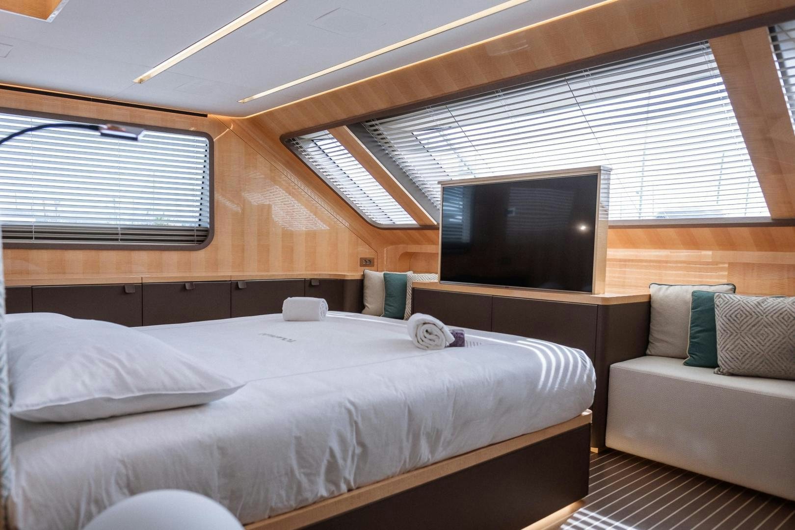 a bed in a room aboard AKAR XIII Yacht for Sale