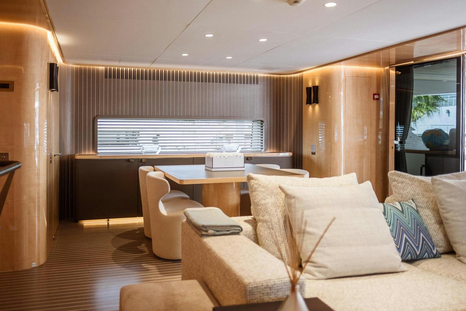 a room with a couch and a table aboard AKAR XIII Yacht for Sale