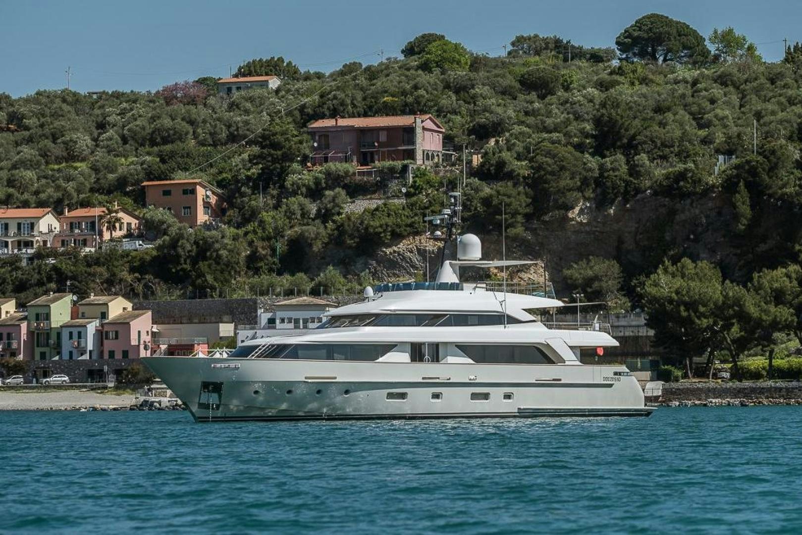 a white yacht in the water aboard AKAR XIII Yacht for Sale