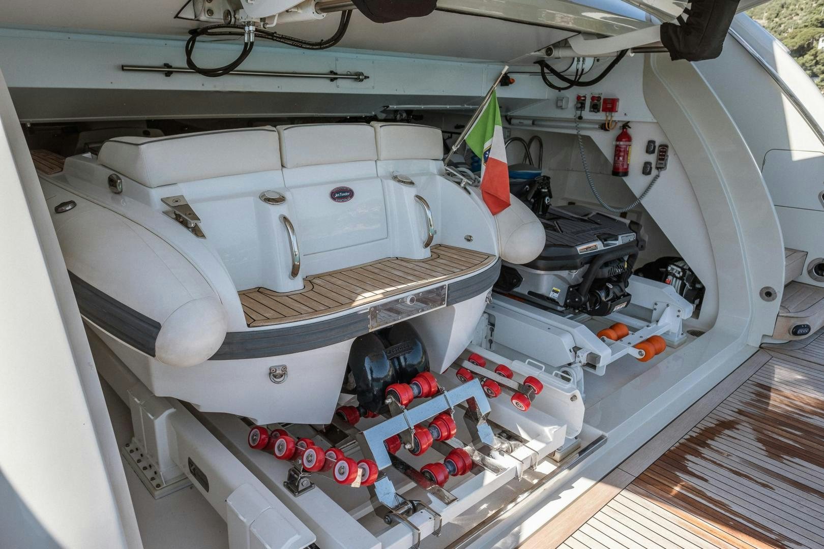 a car with a hood open aboard AKAR XIII Yacht for Sale