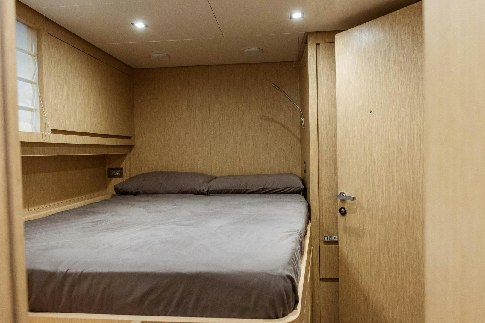 a bed in a room aboard AKAR XIII Yacht for Sale