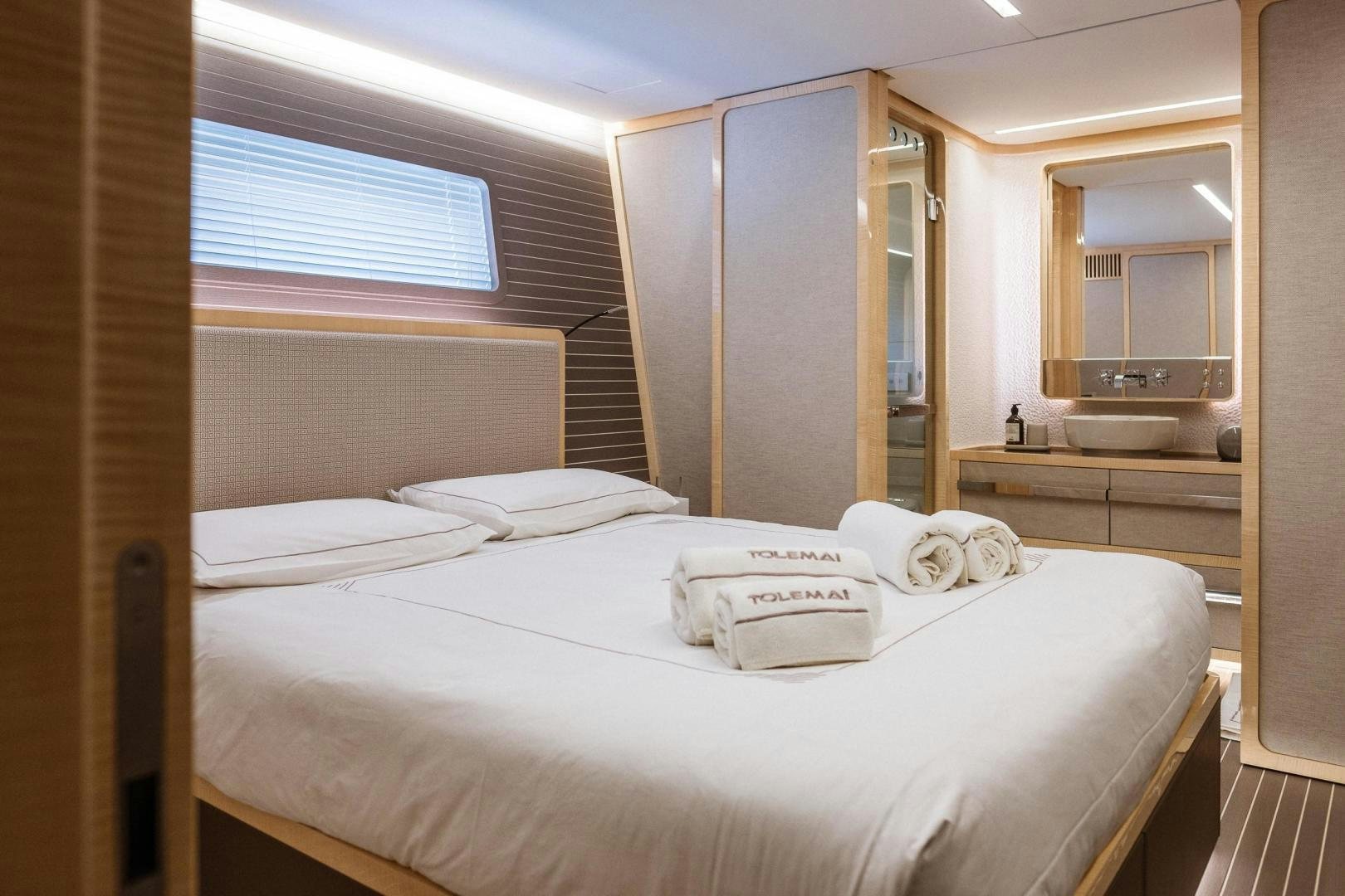 a room with a bed and a sink aboard AKAR XIII Yacht for Sale