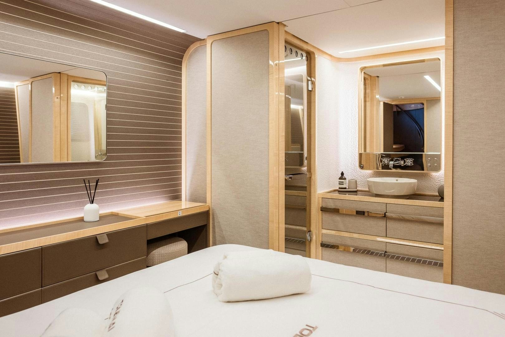 a bathroom with a large mirror aboard AKAR XIII Yacht for Sale