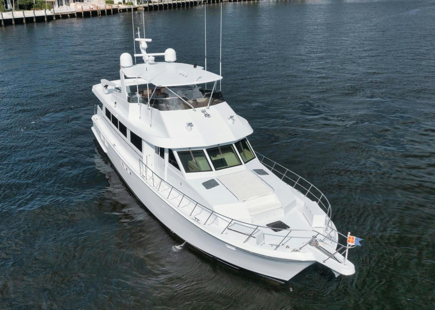 a white boat on the water aboard HATT'S OFF Yacht for Sale