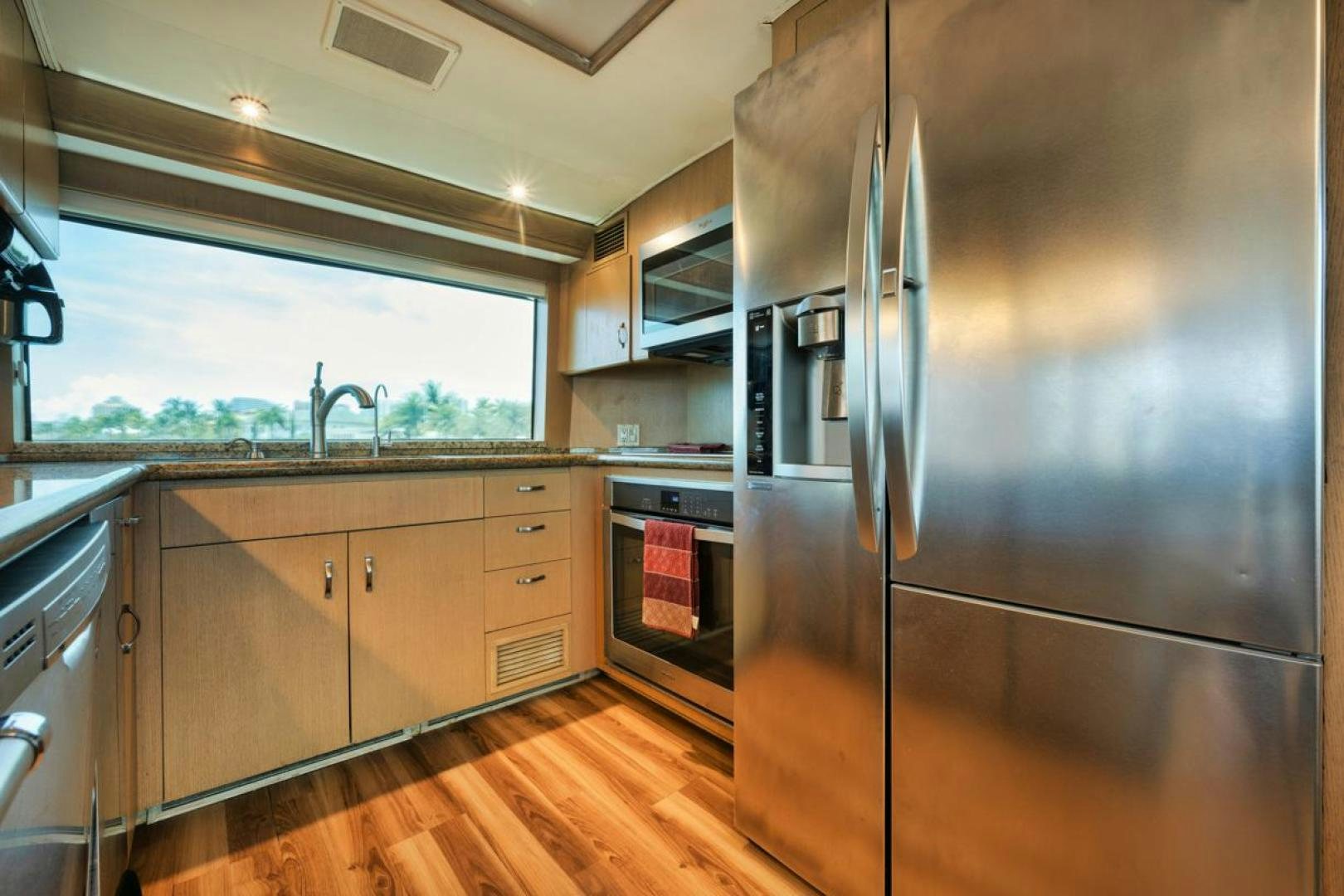 a kitchen with stainless steel appliances aboard HATT'S OFF Yacht for Sale