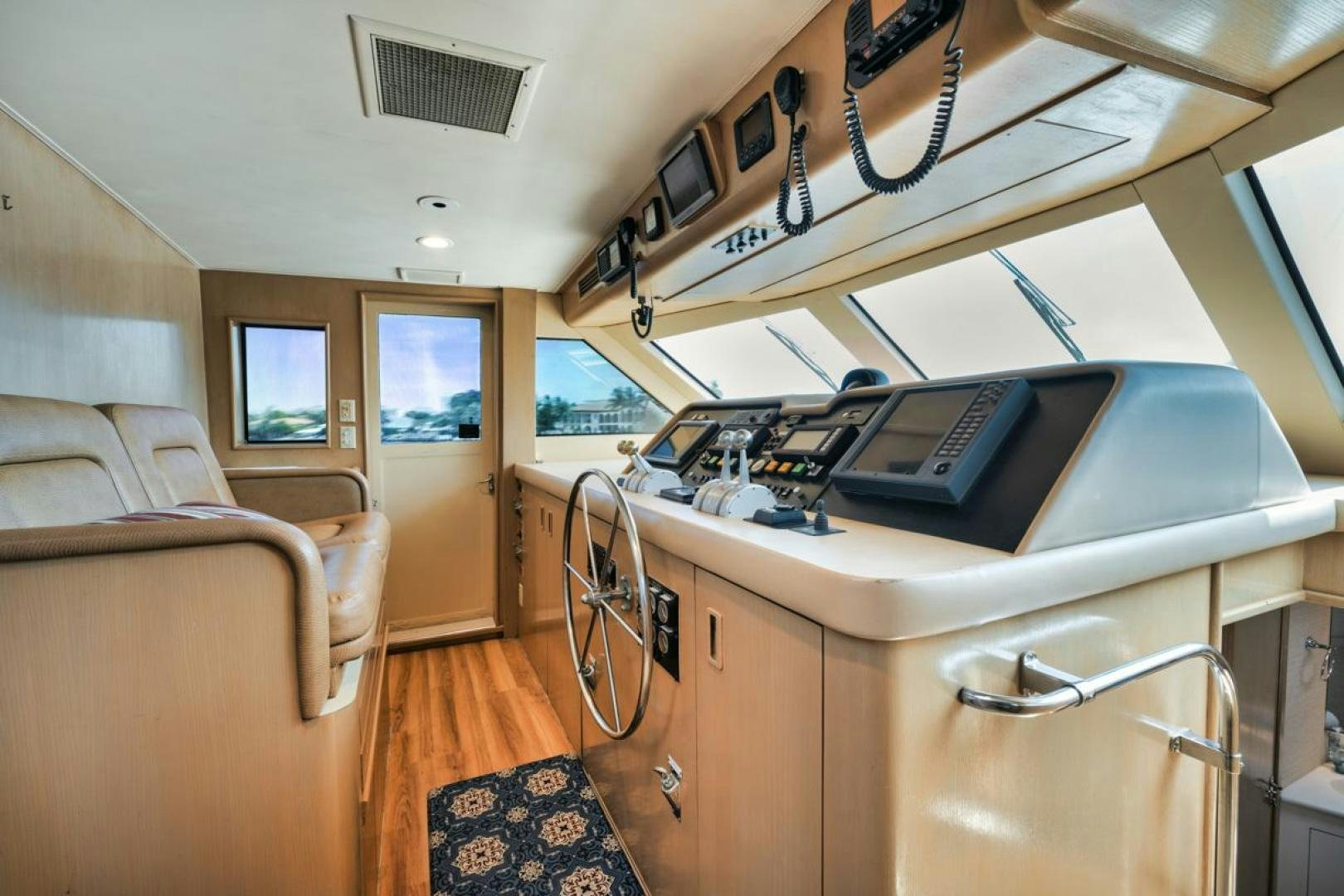 a boat with a desk and a bed aboard HATT'S OFF Yacht for Sale