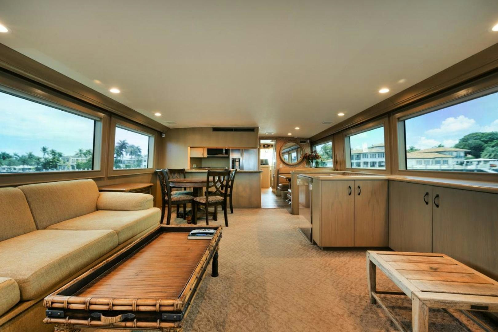 a living room with a couch and a table aboard HATT'S OFF Yacht for Sale