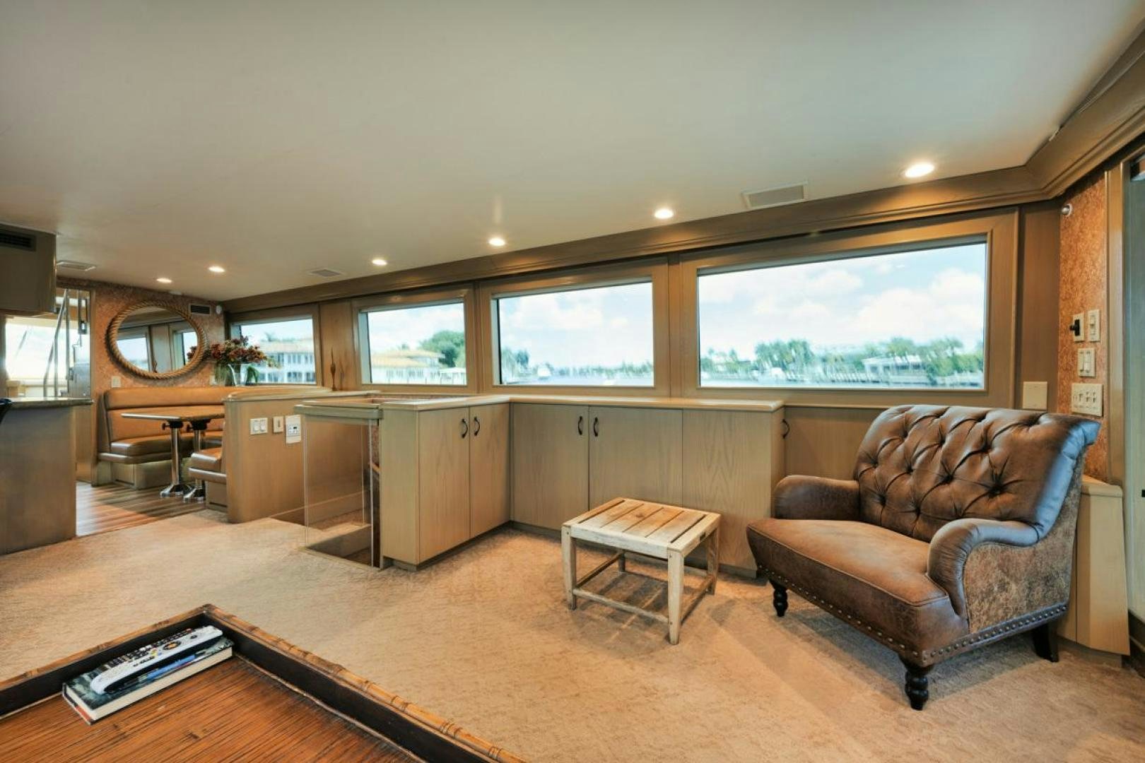 a living room with a couch and a table aboard HATT'S OFF Yacht for Sale