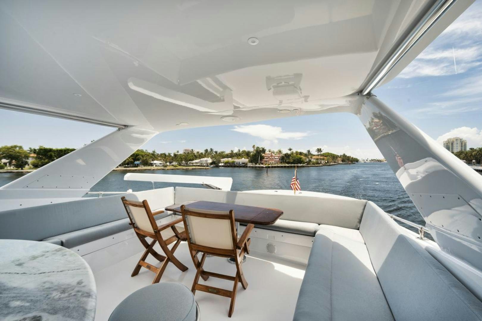 a room with a view of a city and water aboard HATT'S OFF Yacht for Sale