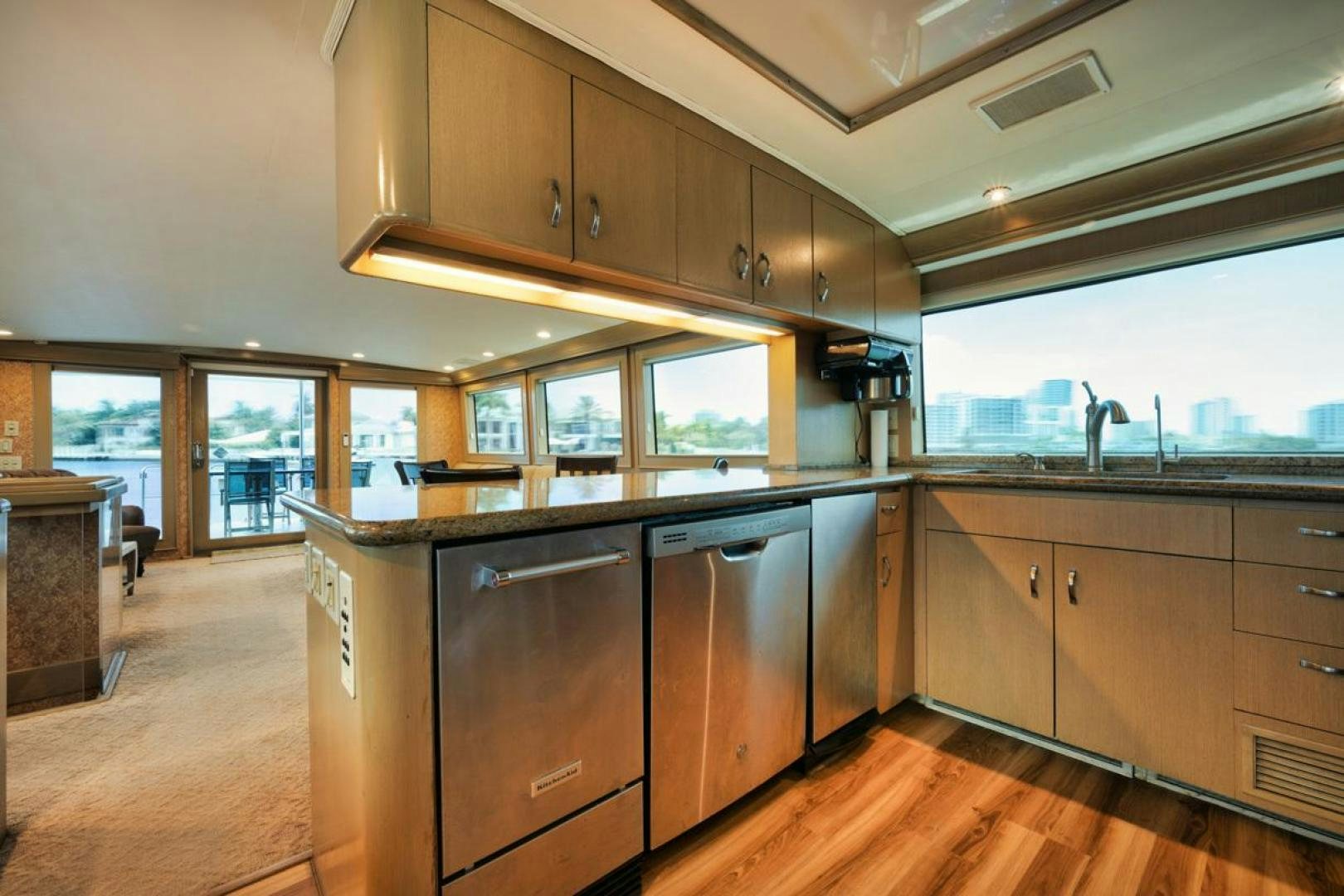 a kitchen with wooden cabinets aboard HATT'S OFF Yacht for Sale