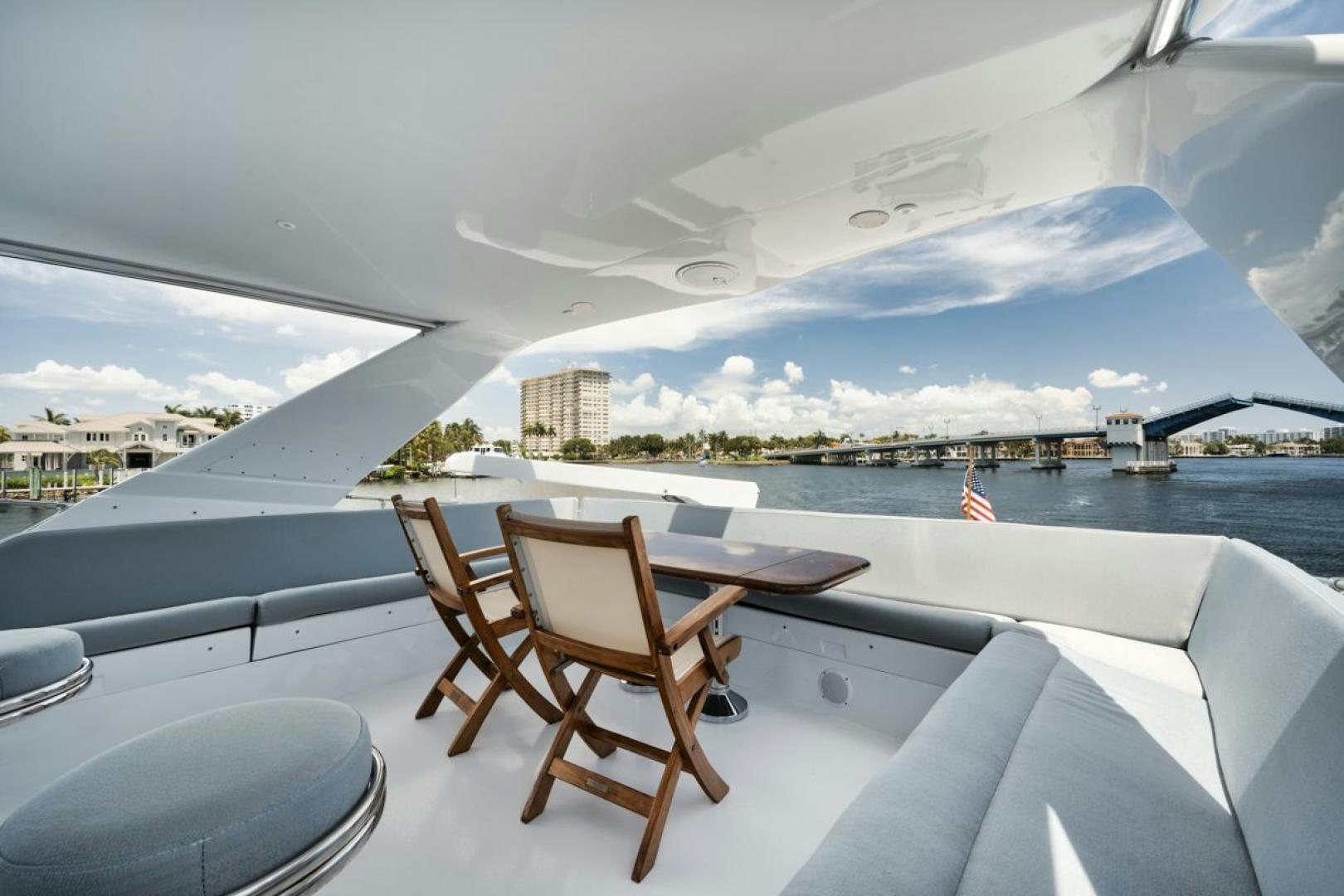 a room with a view of a city and water aboard HATT'S OFF Yacht for Sale