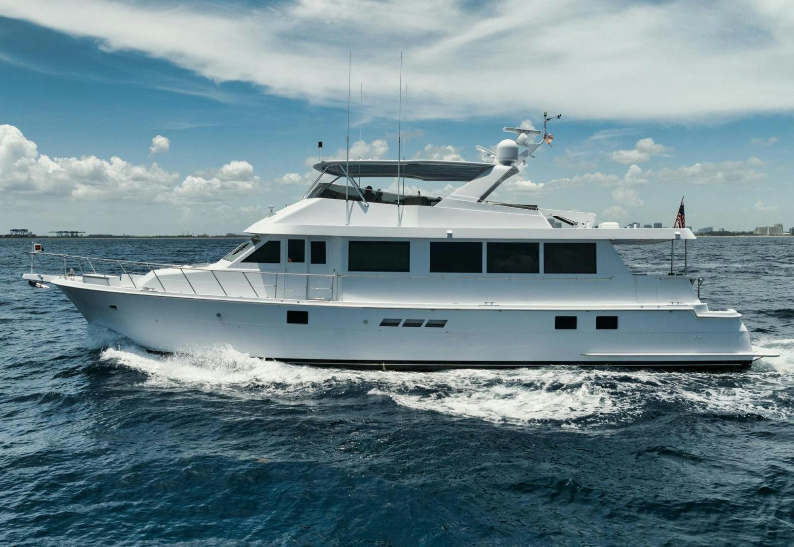 a white yacht in the water aboard HATT'S OFF Yacht for Sale