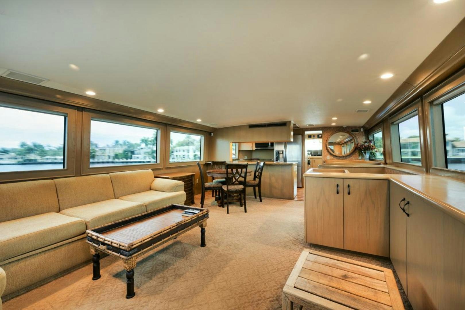 a living room with a couch and a coffee table aboard HATT'S OFF Yacht for Sale