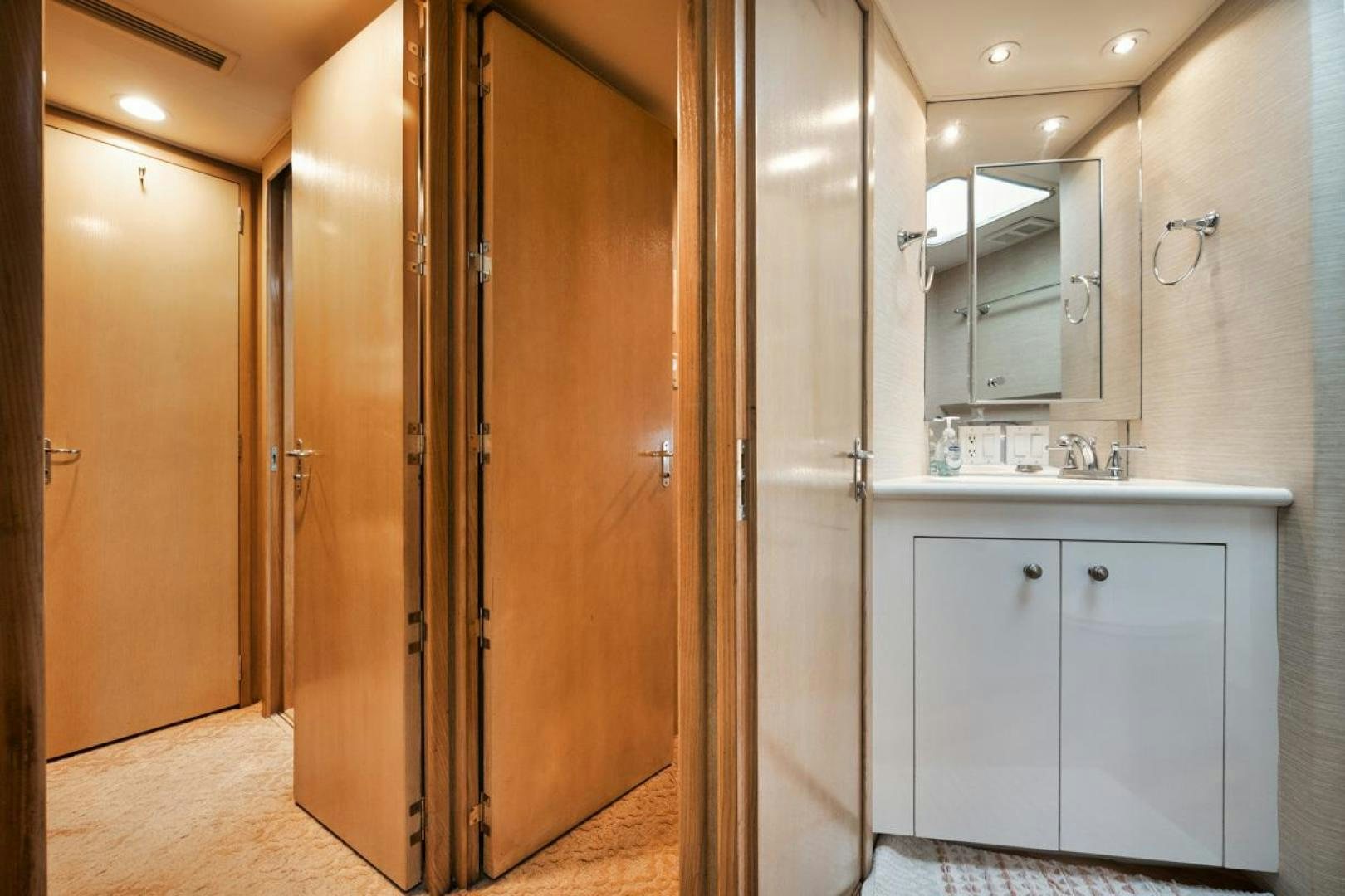 a bathroom with a large closet aboard HATT'S OFF Yacht for Sale