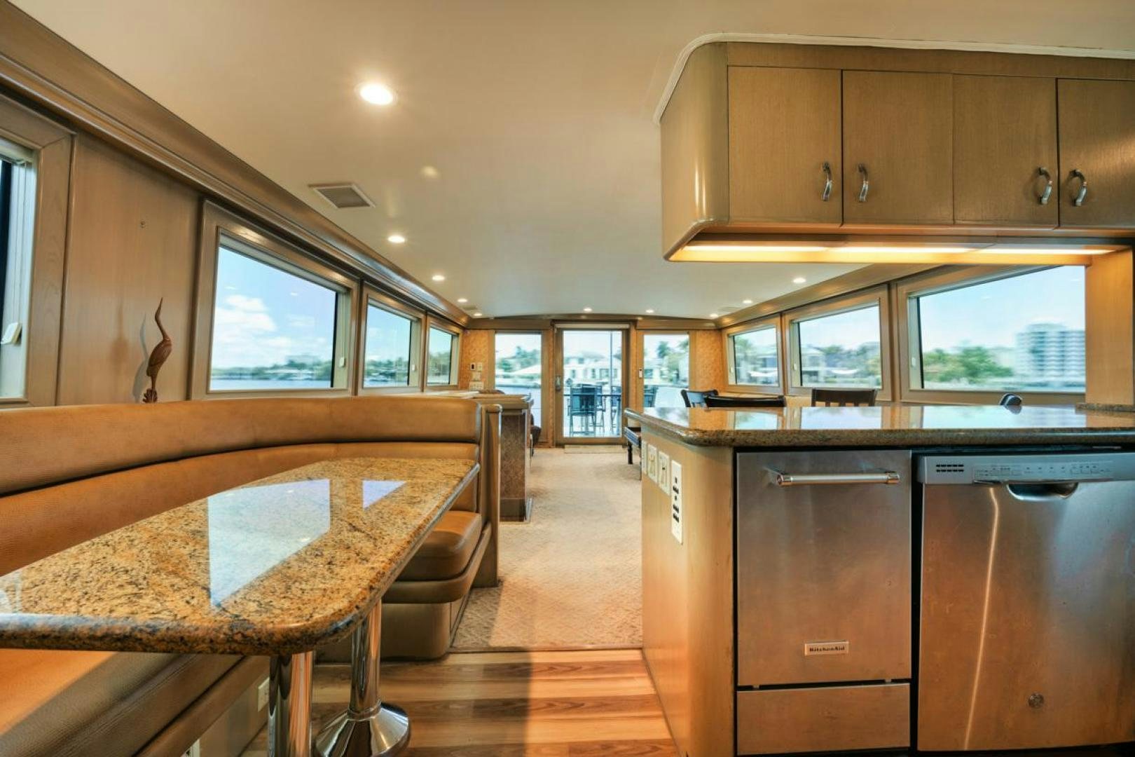 a kitchen with a table and chairs aboard HATT'S OFF Yacht for Sale