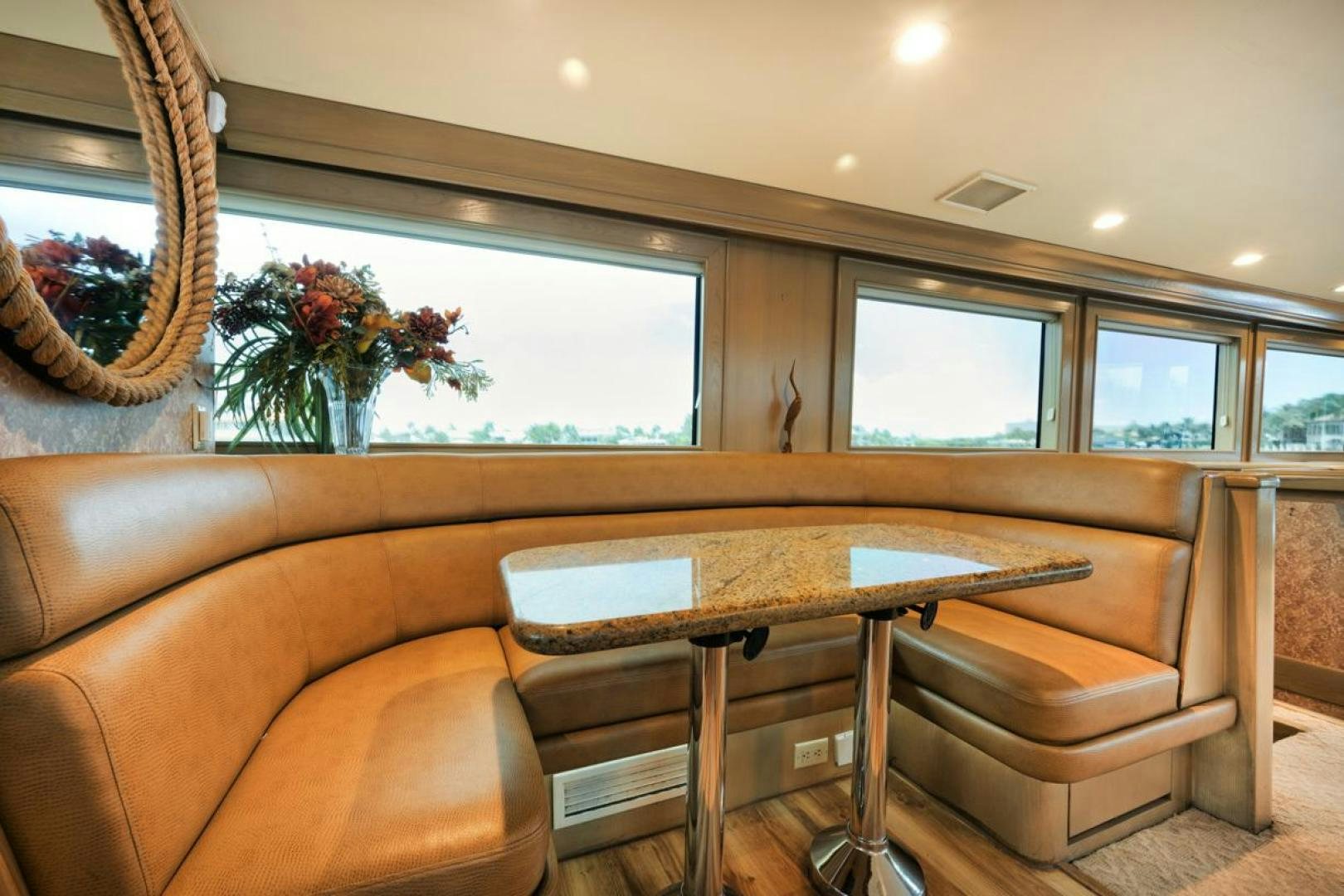 a table and chairs in a room aboard HATT'S OFF Yacht for Sale