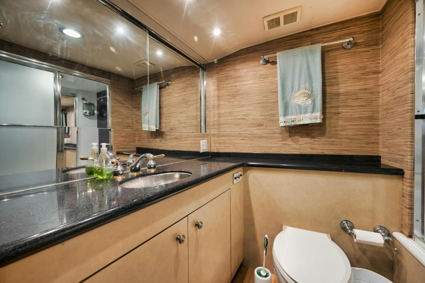 a bathroom with a sink and a bathtub aboard HATT'S OFF Yacht for Sale