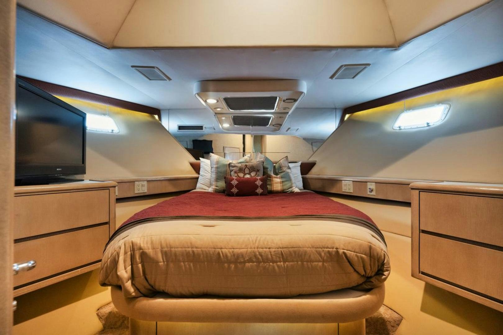 a bed in a room aboard HATT'S OFF Yacht for Sale